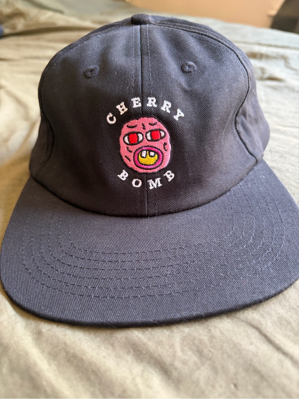 Golf Wang Black Hat with Pink Cherry Bomb Patch